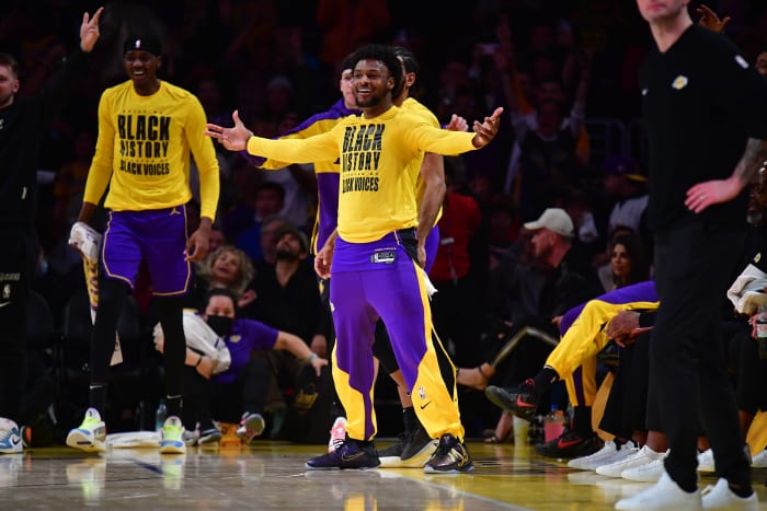 Los Angeles Lakers guard Bronny James (9) reacts after forward LeBron James (23)
