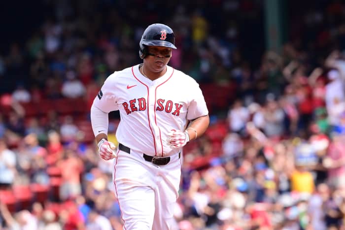 Boston Red Sox third baseman Rafael Devers (11) runs the bases after hitting a three run home run against the Arizona Diamondbacks during the fourth inning at Fenway Park.