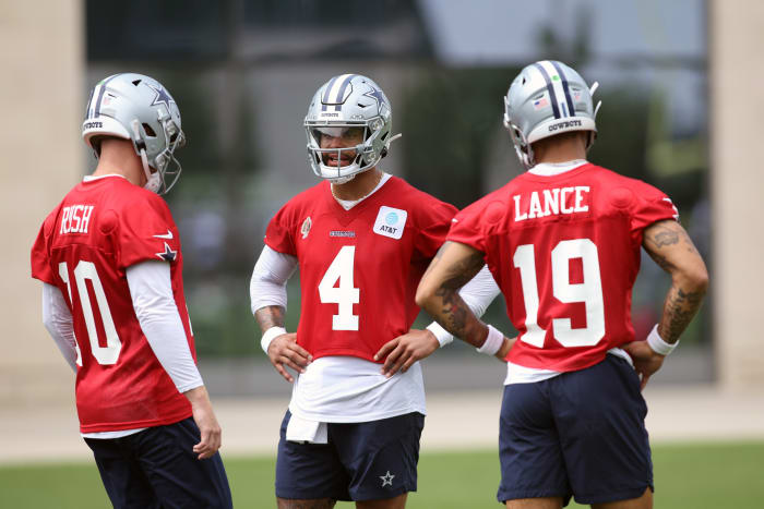 Dallas Cowboys QBs Cooper Rush (10), Dak Prescott (4) and Trey Lance (19) talk during practice at the Ford Center at the Star Training Facility.