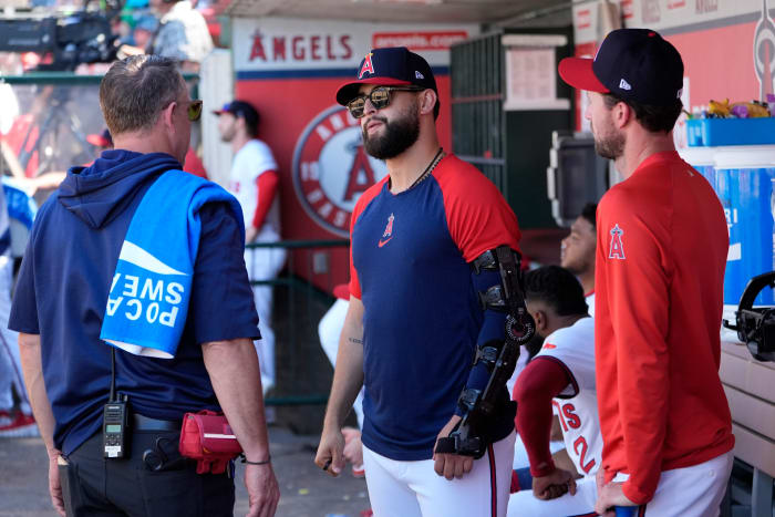 Los Angeles Angels starting pitcher Patrick Sandoval (center) in the dugout during the game against the Oakland Athletics at Angel Stadium.