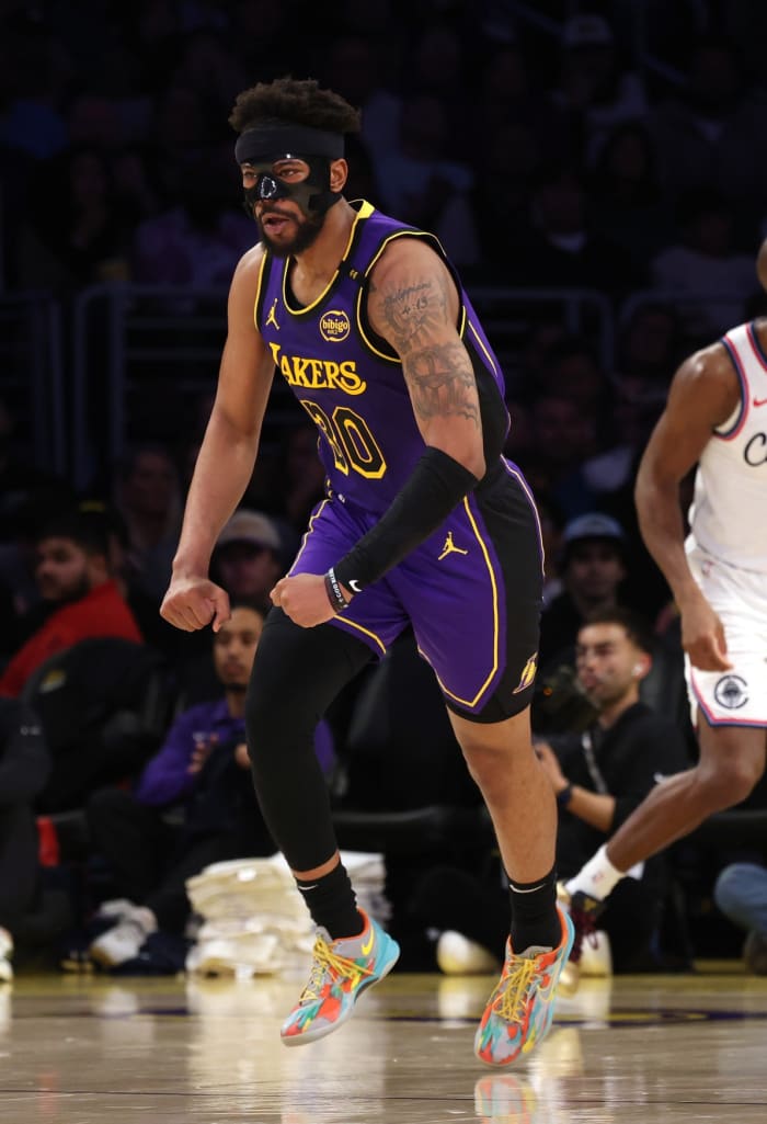 Feb 28, 2025; Los Angeles, California, USA; Los Angeles Lakers guard Jordan Goodwin (30) reacts after a basket during the second quarter against the LA Clippers at Crypto.com Arena.