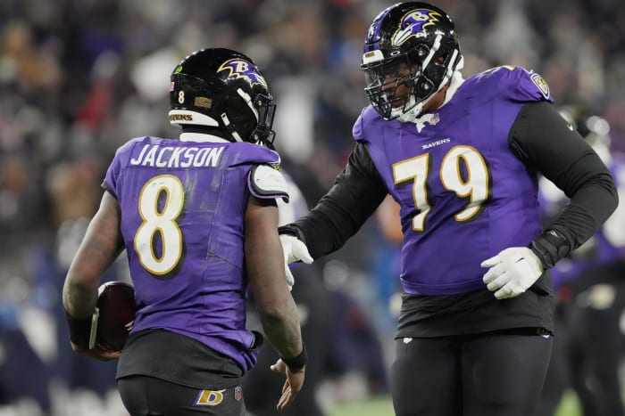 Baltimore Ravens' Lamar Jackson (8) and Ronnie Stanley (79).