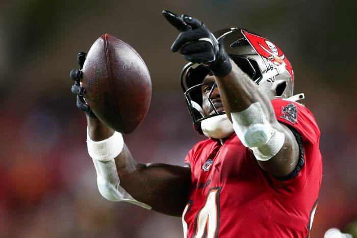 Oct 21, 2024; Tampa, Florida, USA; Tampa Bay Buccaneers wide receiver Chris Godwin (14) celebrates a first down against the Baltimore Ravens in the second quarter at Raymond James Stadium.