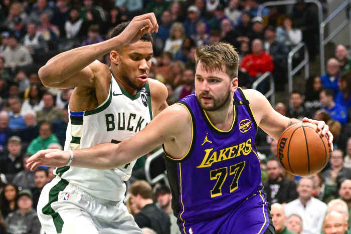 Milwaukee Bucks forward Giannis Antetokounmpo guards Los Angeles Lakers forward Luka Doncic