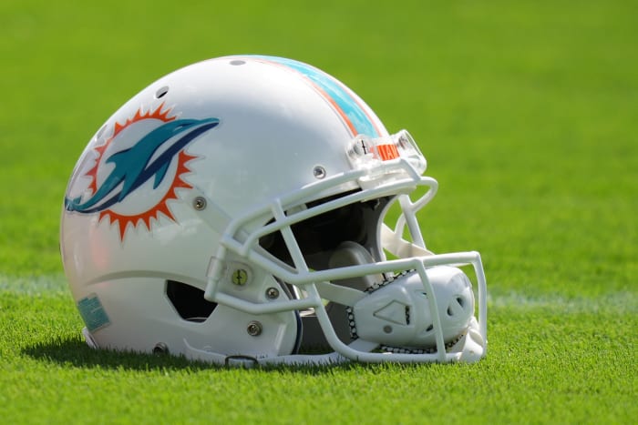 A general view of a Miami Dolphins helmet on the field during practice at Baptist Health Training Complex.
