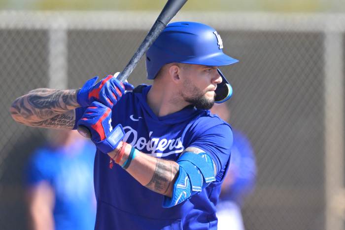 Los Angeles Dodgers center fielder Andy Pages (44) takes live batting practice during spring training workouts at Camelback Ranch.
