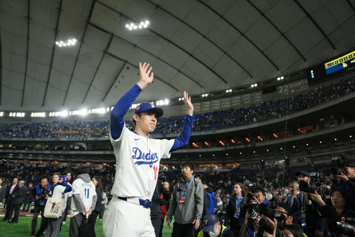 Mar 19, 2025; Bunkyo, Tokyo, JPN; Los Angeles Dodgers starting pitcher Roki Sasaki (11) waves to the crowd after defeating the Chicago Cubs during the Tokyo Series at Tokyo Dome.