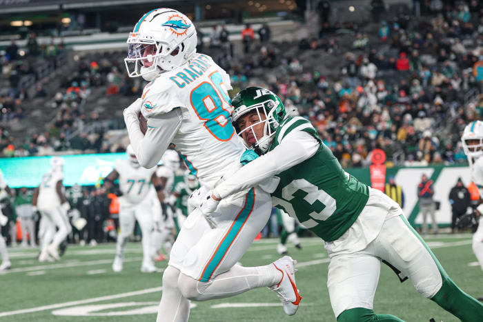 Miami Dolphins wide receiver River Cracraft (85) is tackled by New York Jets cornerback Isaiah Oliver (23) after a reception during the second half at MetLife Stadium.