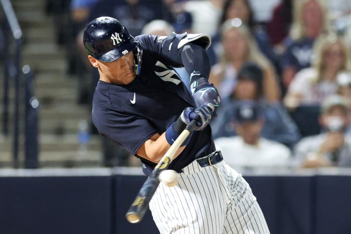 Mar 14, 2025; Tampa, Florida, USA; New York Yankees outfielder Aaron Judge (99) singles against the Philadelphia Phillies in the sixth inning during spring training at George M. Steinbrenner Field.