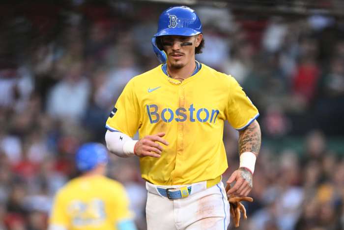 Boston Red Sox center fielder Jarren Duran (16) runs off of the field after scoring a run against the Tampa Bay Rays during the sixth inning at Fenway Park.