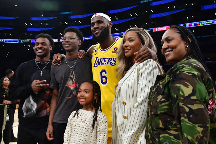 Los Angeles Lakers forward LeBron James (6) poses for photos with his sons Bronny and Bryce Maximus, daughter Zhuri, wife Savannah and mother Gloria after the game against the Oklahoma City Thunder at Crypto.com Arena. Mandatory Credit: Gary A. Vasquez-Imagn Images