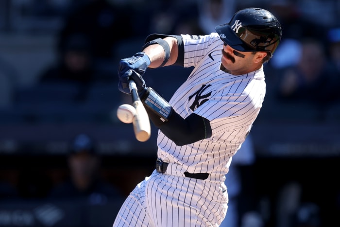 New York Yankees catcher Austin Wells (28) hits a solo home run against the Milwaukee Brewers during the first inning at Yankee Stadium.