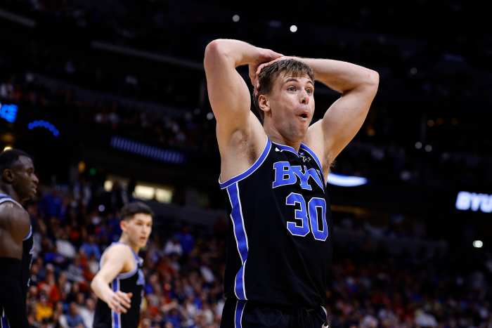 Brigham Young Cougars guard Dallin Hall (30) reacts against the Wisconsin Badgers during the first half in the second round of the NCAA Tournament at Ball Arena