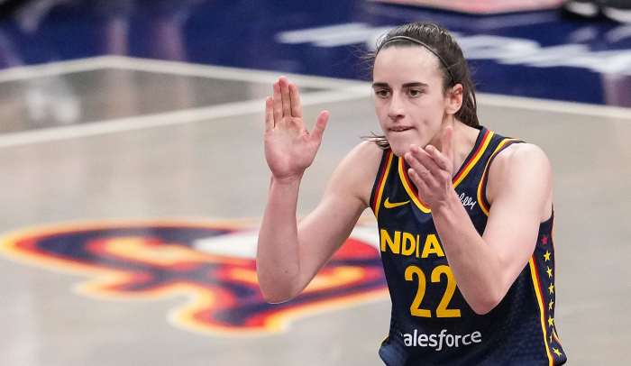 Indiana Fever guard Caitlin Clark (22) claps her hands in excitement Sunday, July 13, 2025, during the game at Gainbridge Fieldhouse in Indianapolis.