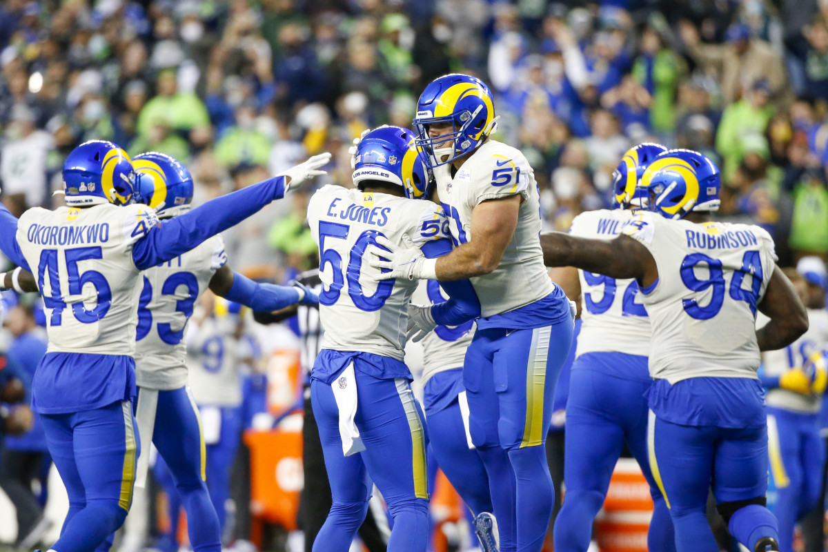 Los Angeles Rams linebacker Troy Reeder (51) and linebacker Ernest Jones (50) celebrate following a missed field goal by the Seattle Seahawks during the second quarter at Lumen Field.