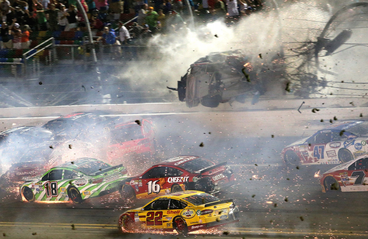 During the final lap of the rain-delayed Coke Zero 400 NASCAR race, driver Austin Dillon was involved in a spectacular crash that sent his car flying into the catchfence at Daytona International Speedway.   While Dillon walked away from the accident, debris flew into the stands injuring a handful of spectators. 