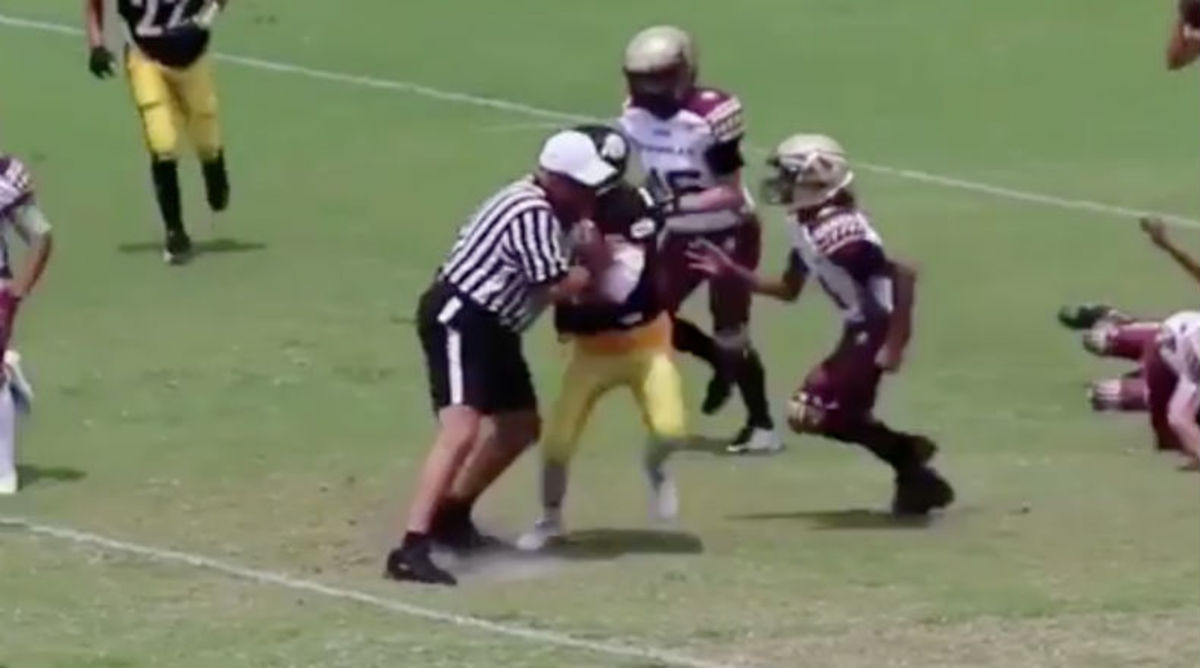 VIDEO: Referee Drops Shoulder and Levels QB 