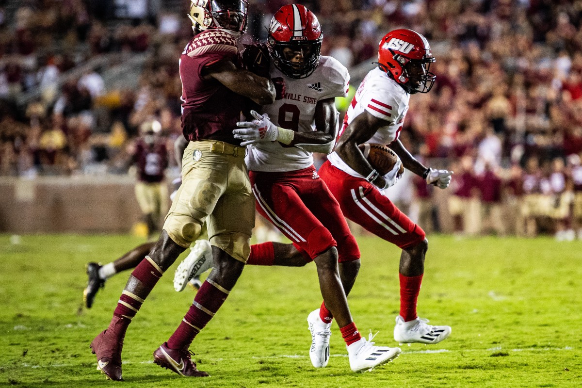 Jacksonville State wide receiver Damond Philyaw-Johnson, rear, nears the goal line for his game-winning, 59-yard touchdown on the final play of a 20-17 win at Florida State on Saturday, Sept. 11, 2021