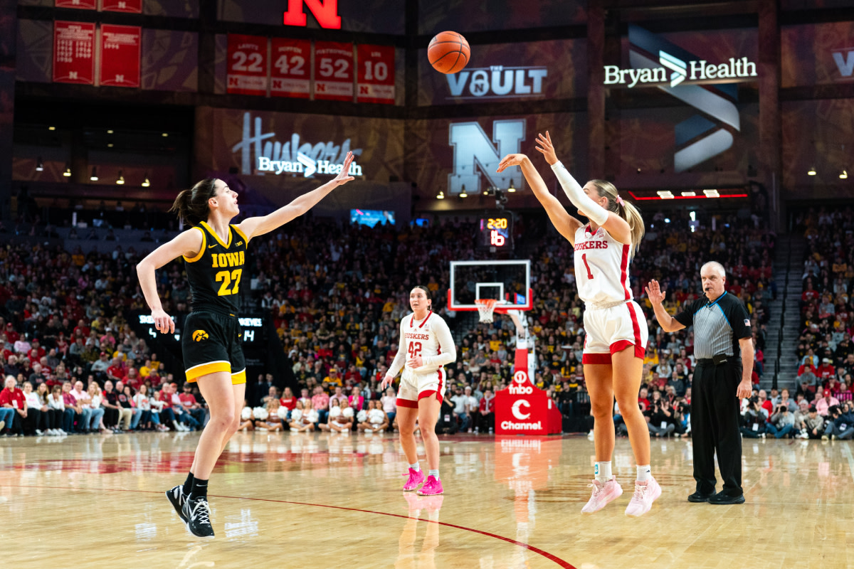 Nebraska Cornhuskers guard Jaz Shelley (1) shoots a three point shot against Iowa Hawkeyes guard Caitlin Clark (22) during the first quarter at Pinnacle Bank Arena.