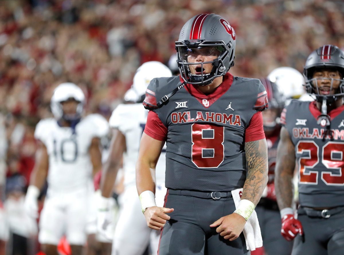 Oklahoma's Dillon Gabriel (8) celebrates a touchdown in the first half of a college football game between the University of Oklahoma Sooners and the West Virginia Mountaineers.