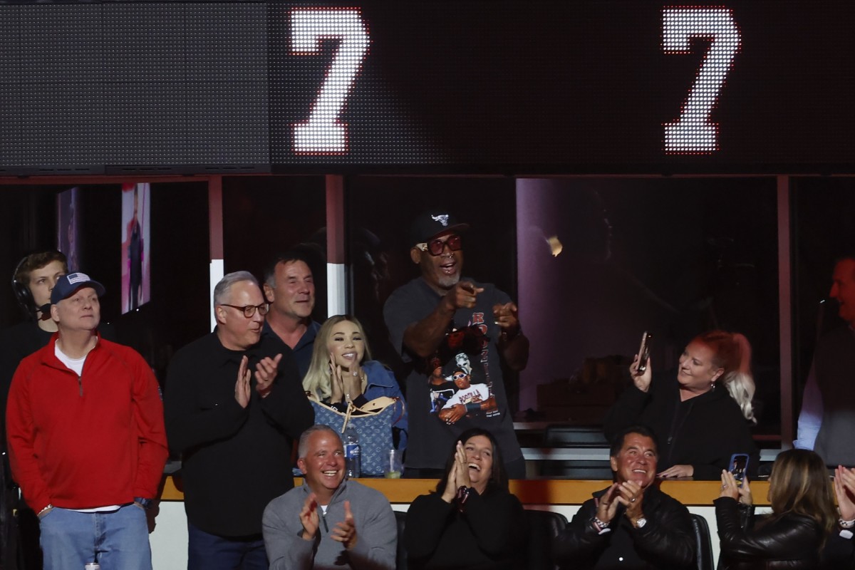 Dennis Rodman attends former Chicago Blackhawks great Chris Chelios jersey retirement ceremony before an NHL hockey game between the Chicago Blackhawks and Detroit Red Wings at United Center.