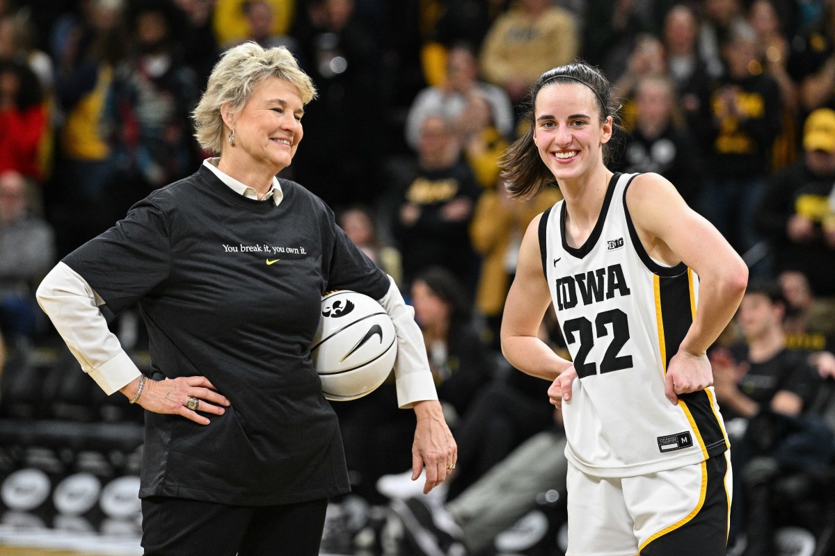 Feb 15, 2024; Iowa City, Iowa, USA; Iowa Hawkeyes guard Caitlin Clark (22) reacts with head coach Lisa Bluder after the game at Carver-Hawkeye Arena against the Michigan Wolverines. During the game Clark would break the NCAA women's all-time scoring record. Mandatory Credit: Jeffrey Becker-USA TODAY Sports