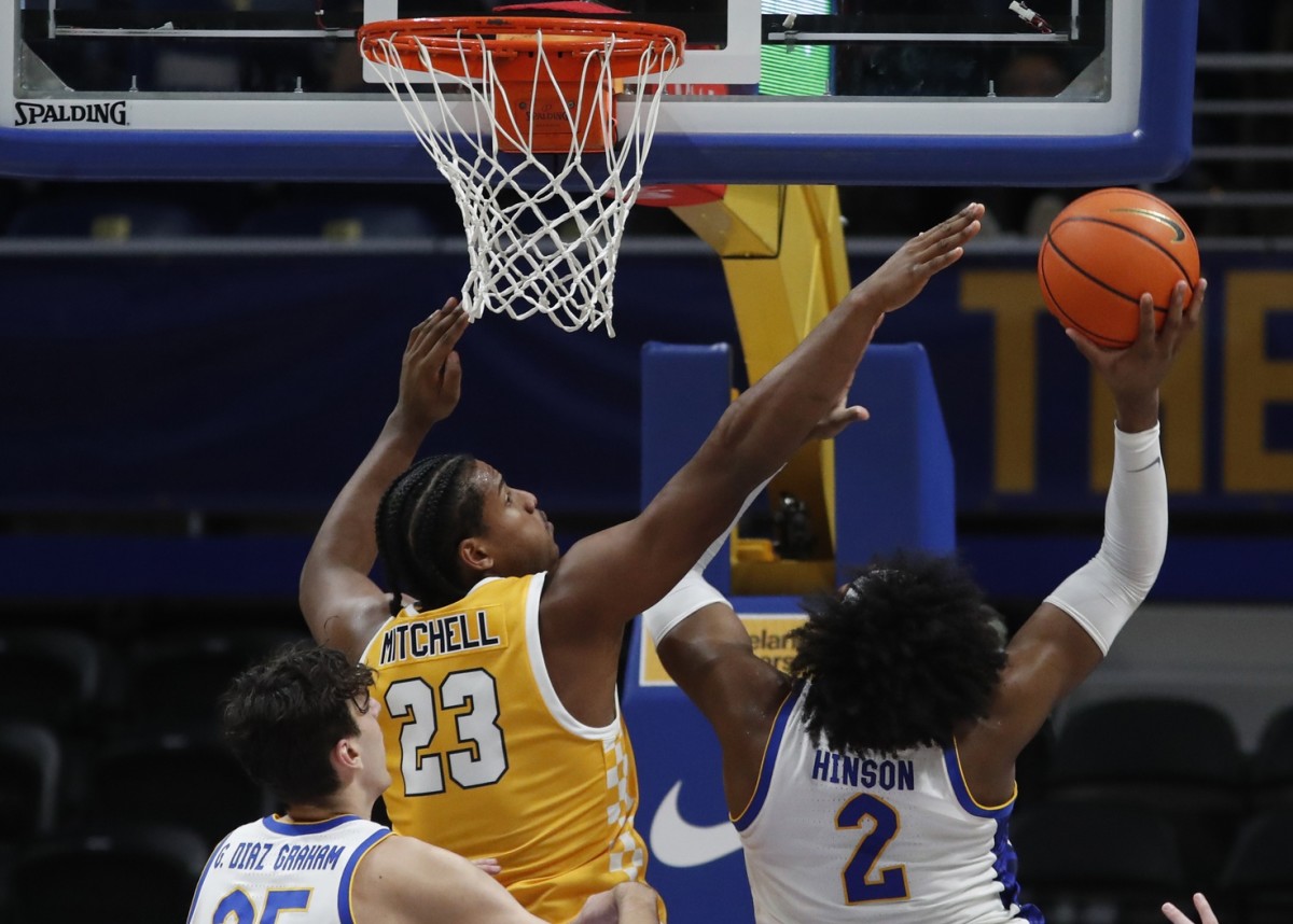 Dec 9, 2023; Pittsburgh, Pennsylvania, USA; Pittsburgh Panthers forward Blake Hinson (2) shoots as Canisius Golden Griffins forward Frank Mitchell (23) defends during the second half at the Petersen Events Center. Pittsburgh won 82-71.