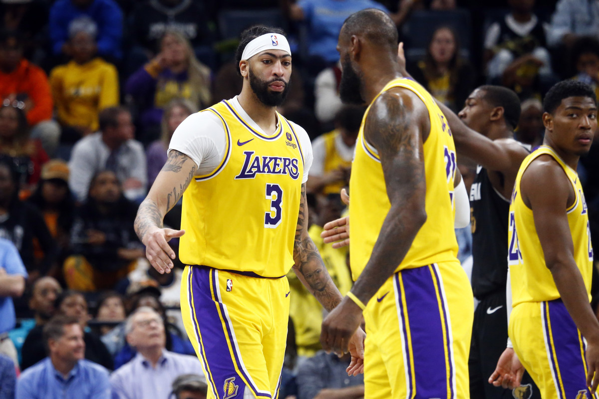 Apr 12, 2024; Memphis, Tennessee, USA; Los Angeles Lakers forward Anthony Davis (3) reacts with forward LeBron James (23) during the second half against the Memphis Grizzlies at FedExForum.