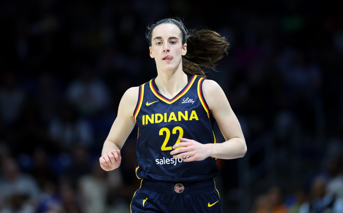 Indiana Fever guard Caitlin Clark (22) reacts during the second quarter against the Dallas Wings at College Park Center. 