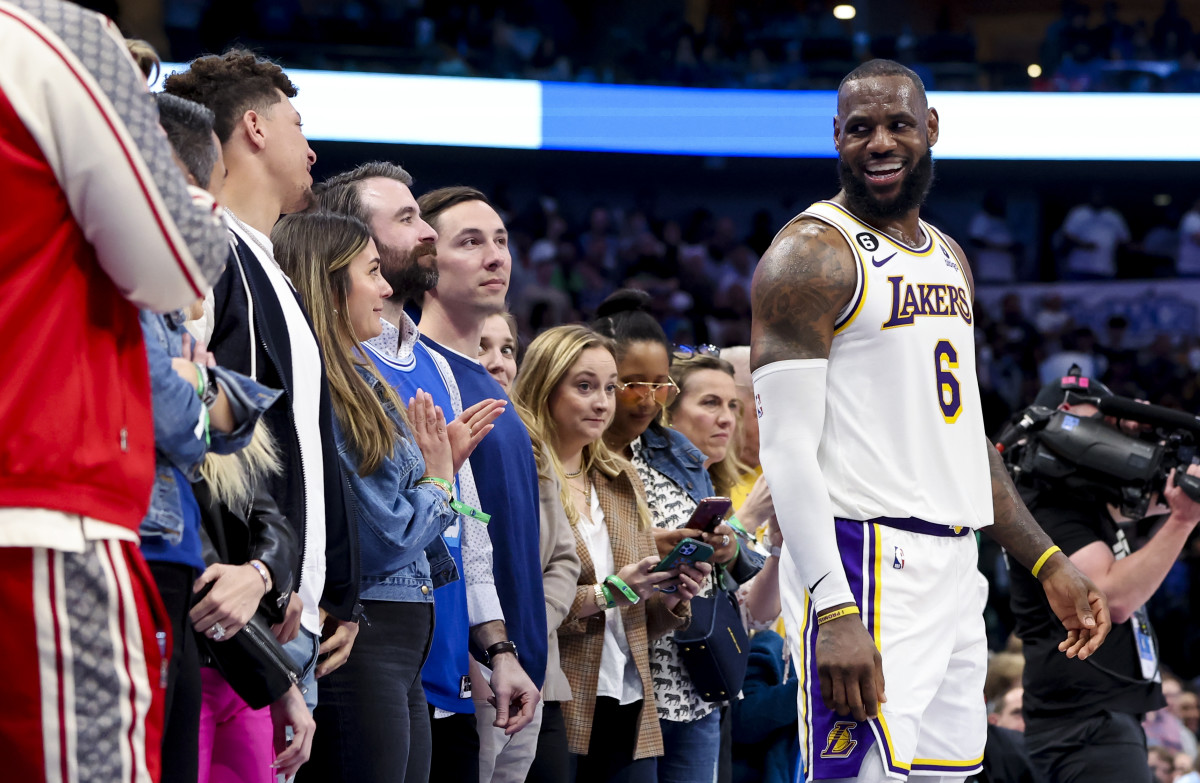 Feb 26, 2023; Dallas, Texas, USA; Los Angeles Lakers forward LeBron James (6) laughs with Kansas City Chiefs quarterback Patrick Mahomes during the fourth quarter against the Dallas Mavericks at American Airlines Center.