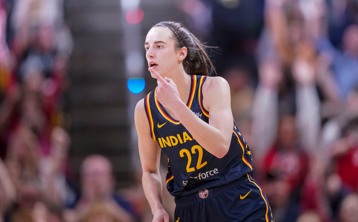 Indiana Fever guard Caitlin Clark (22) reacts to scoring three points Thursday, May 9, 2024, during the preseason game against the Atlanta Dream.