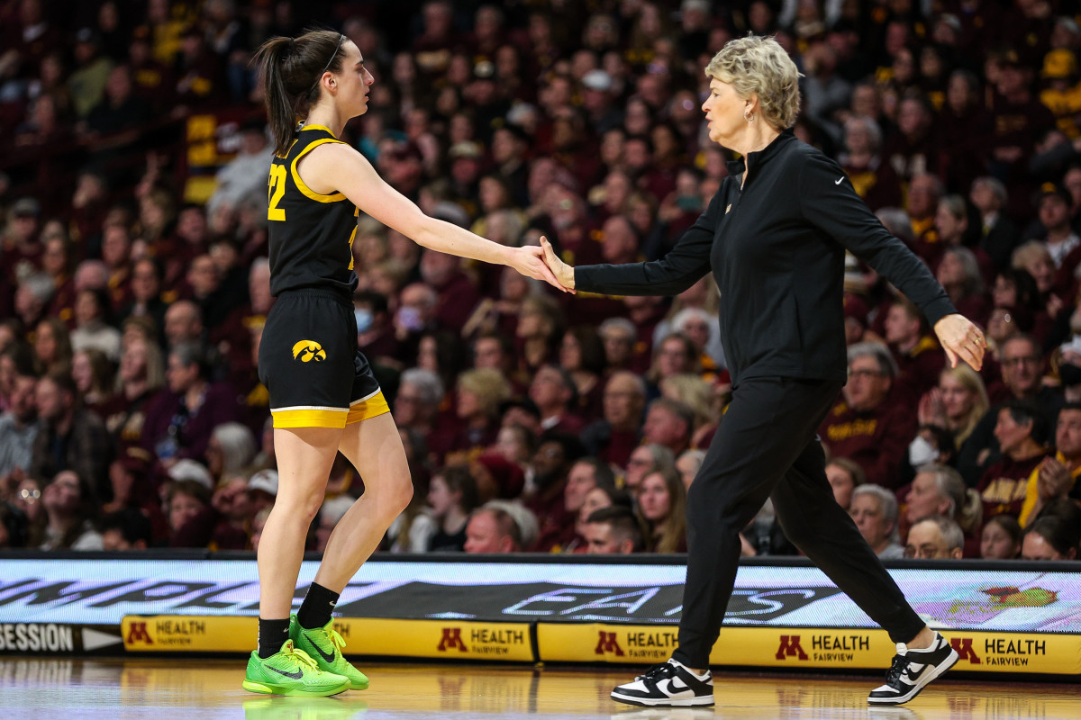 Feb 28, 2024; Minneapolis, Minnesota, USA; Iowa Hawkeyes guard Caitlin Clark (22) and head coach Lisa Bluder react during the first half against the Minnesota Golden Gophers at Williams Arena. Mandatory Credit: Matt Krohn-USA TODAY Sports