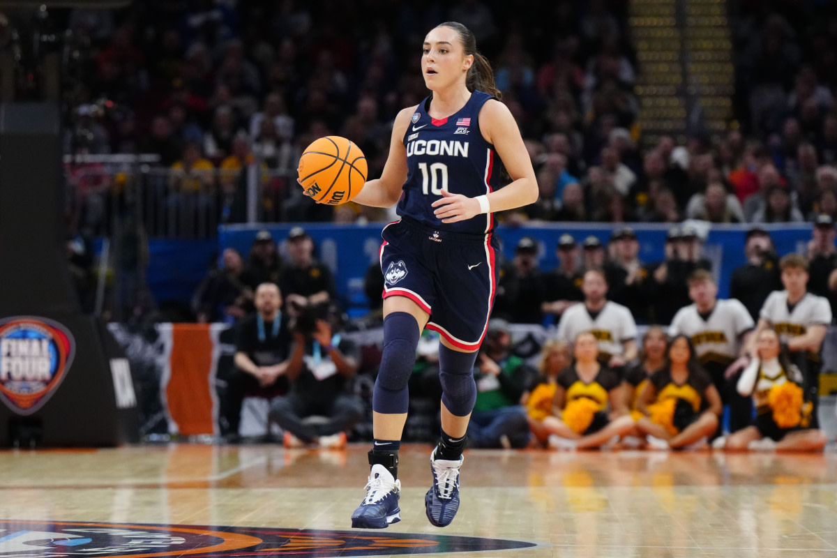 Connecticut Huskies guard Nika Muhl (10) controls the ball in the third quarter against the Iowa Hawkeyes in the semifinals of the Final Four of the womens 2024 NCAA Tournament at Rocket Mortgage FieldHouse.