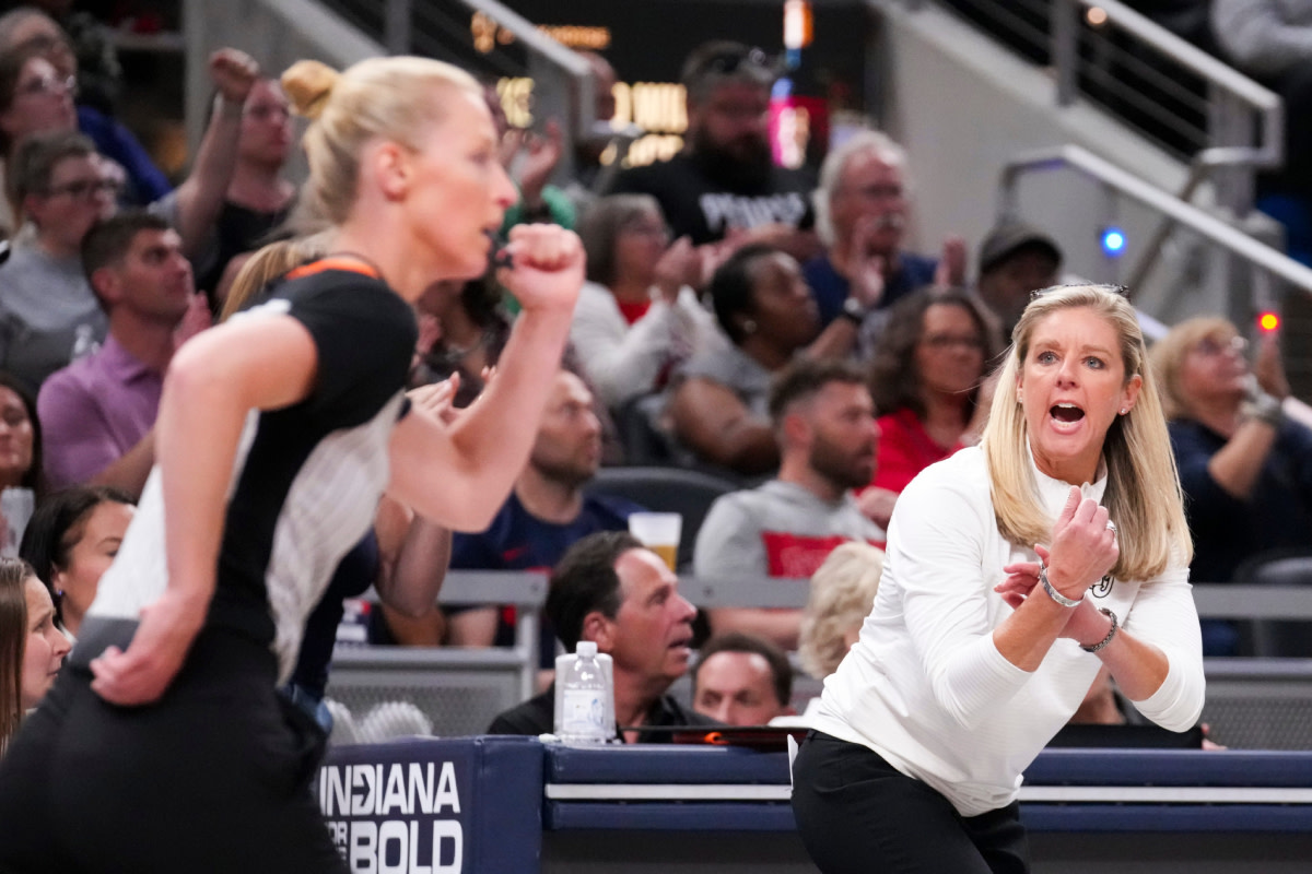 Indiana Fever head coach Christie Sides yells on the side of the court, Thursday, May 16, 2024, during the Indiana Fever home opener game against the New York Liberty at Gainbridge Fieldhouse in Indianapolis.  