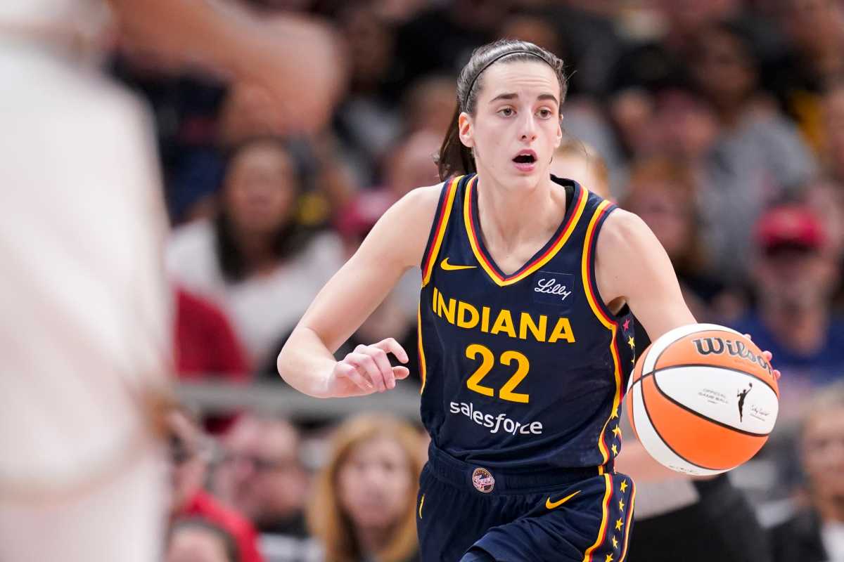 Indiana Fever guard Caitlin Clark (22) dribbles the ball down court, Thursday, May 16, 2024, during the Indiana Fever home opener game against the New York Liberty at Gainbridge Fieldhouse in Indianapolis.