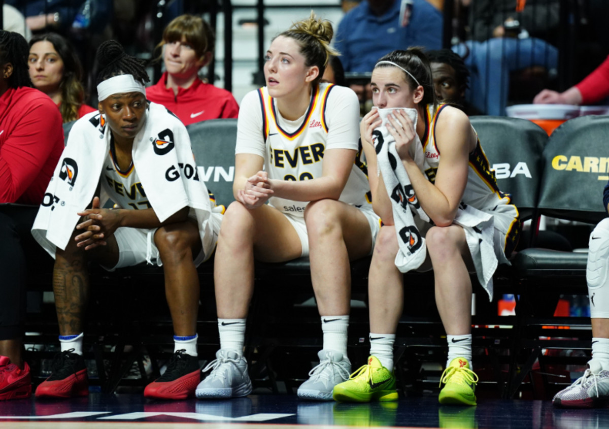 May 14, 2024; Uncasville, Connecticut, USA; Indiana Fever guard Caitlin Clark (22), forward Katie Lou Samuelson (33) and guard Erica Wheeler (17) on the bench against the Connecticut Sun in the first quarter at Mohegan Sun Arena. Mandatory Credit: David Butler II-USA TODAY Sports 