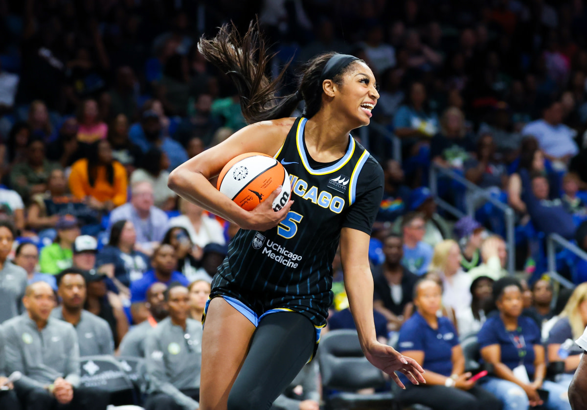 Chicago Sky forward Angel Reese (5) laughs during the second half against the Dallas Wings at College Park Center.
