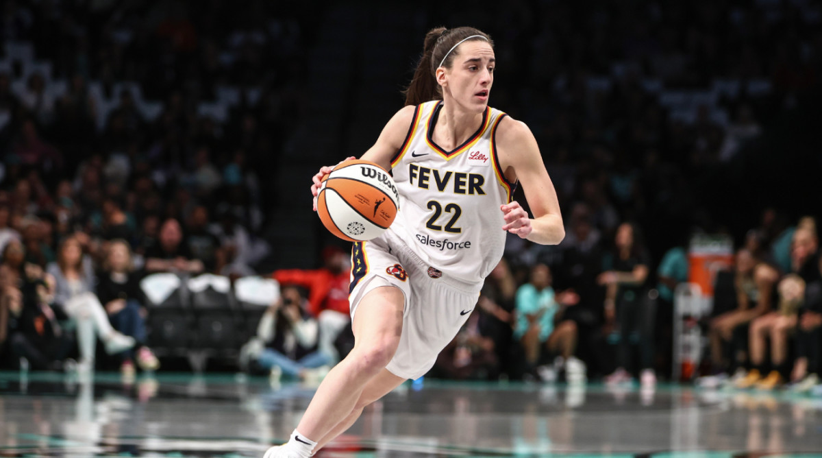 Caitlin Clark dribbles the WNBA’s Wilson basketball during an Indiana Fever game.