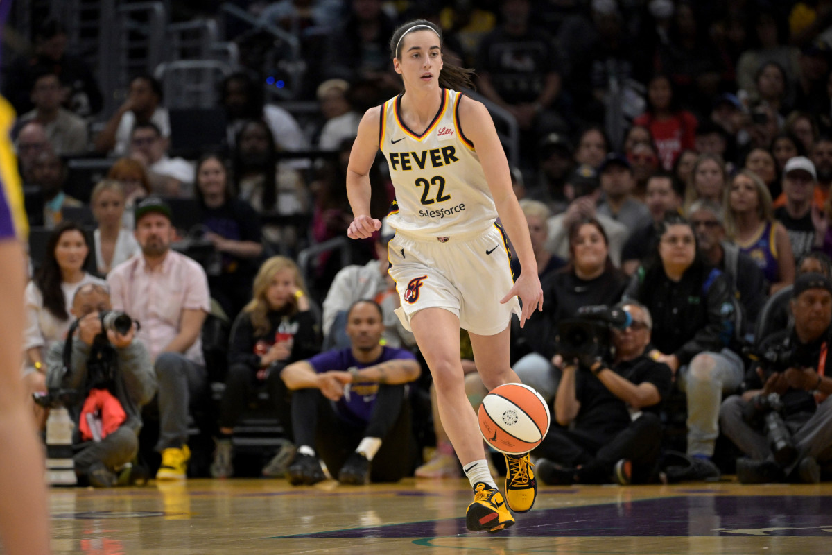 May 24, 2024; Los Angeles, California, USA; Indiana Fever guard Caitlin Clark (22) takes the ball down court in the first half against the Los Angeles Sparks at Crypto.com Arena.