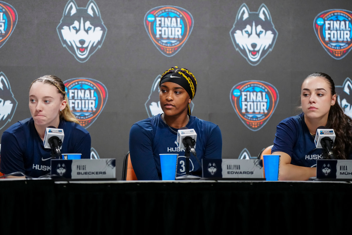 UConn Huskies guard Paige Bueckers (left), forward Aaliyah Edwards (center) and guard Nika Muhl during press conference at Rocket Mortgage FieldHouse.