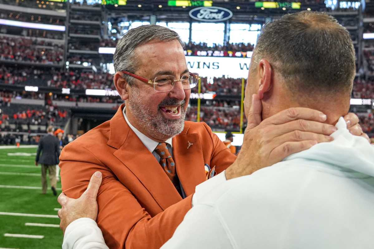 University of Texas at Austin athletic director Chris Del Conte celebrates with head coach Steve Sarkisian after the 49-21 win over Oklahoma State in the Big 12 Championship game at AT&T stadium on Saturday, Dec. 2, 2023 in Arlington.