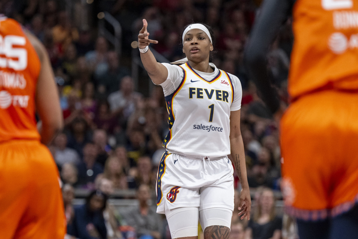 Indiana Fever forward NaLyssa Smith (1) reacts after scoring a 3-point basket during the first half of an WNBA basketball game against the Connecticut Sun, Monday, May 20, 2024, at Gainbridge Fieldhouse.