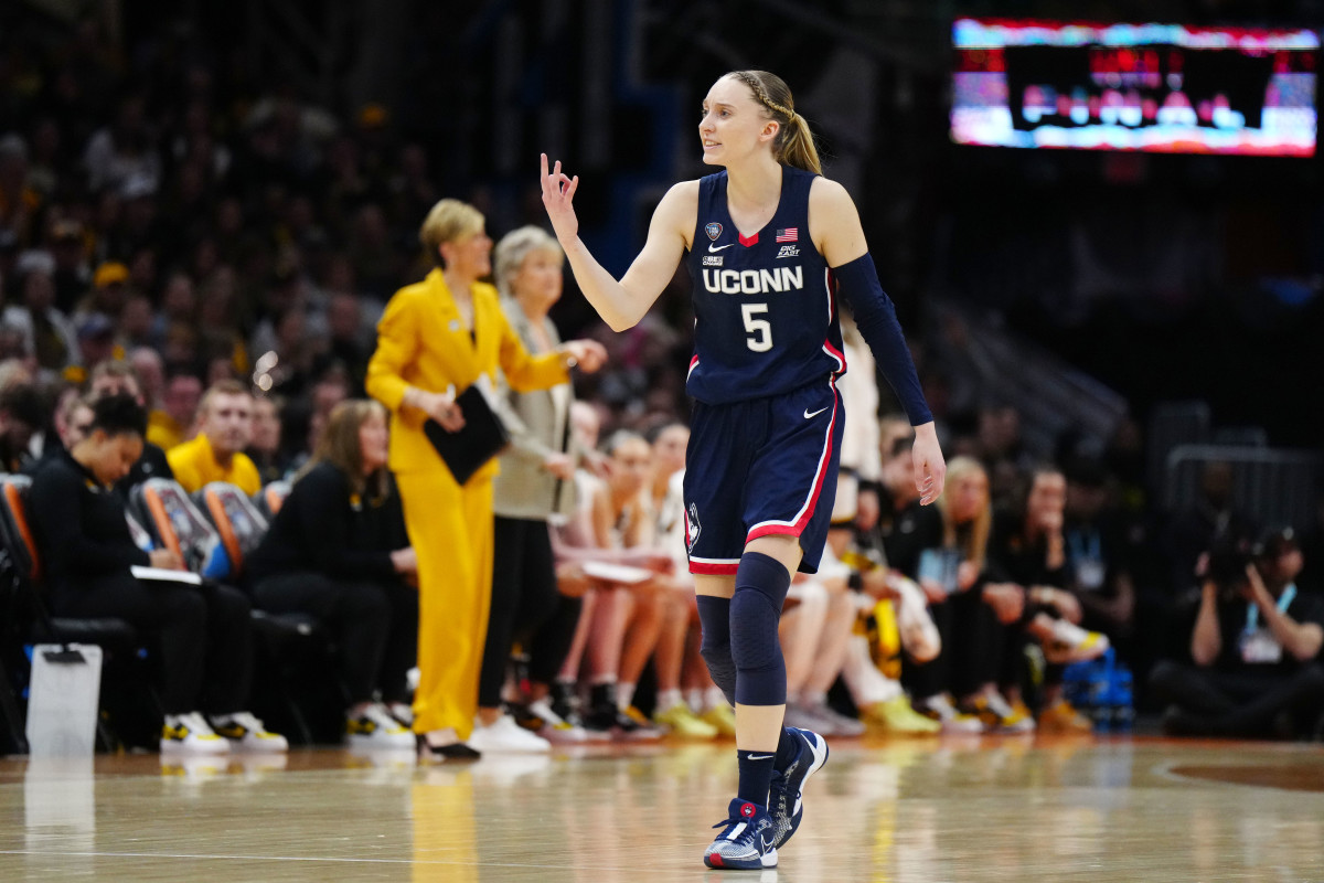Connecticut Huskies guard Paige Bueckers (5) reacts in the second quarter against the Iowa Hawkeyes in the semifinals of the Final Four of the womens 2024 NCAA Tournament at Rocket Mortgage FieldHouse.