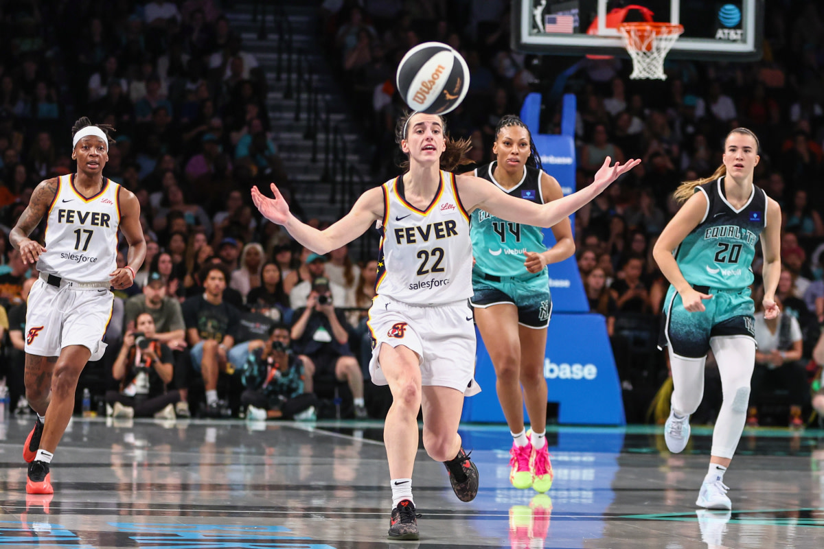 Indiana Fever guard Caitlin Clark (22) reacts after making a pass in the second quarter against the New York Liberty at Barclays Center.