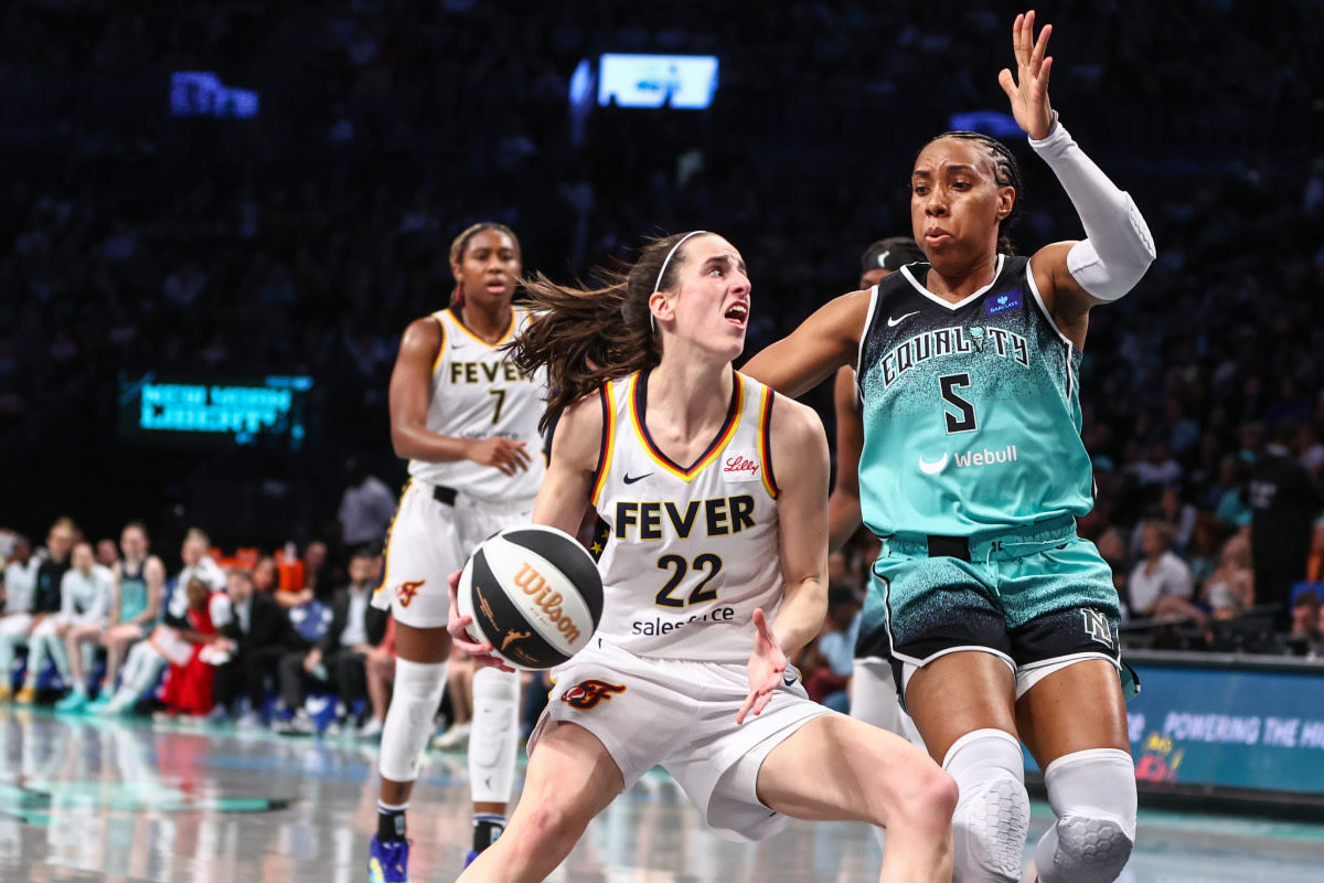Indiana Fever guard Caitlin Clark (22) looks to drive past New York Liberty forward Kayla Thornton (5) in the second quarter at Barclays Center.