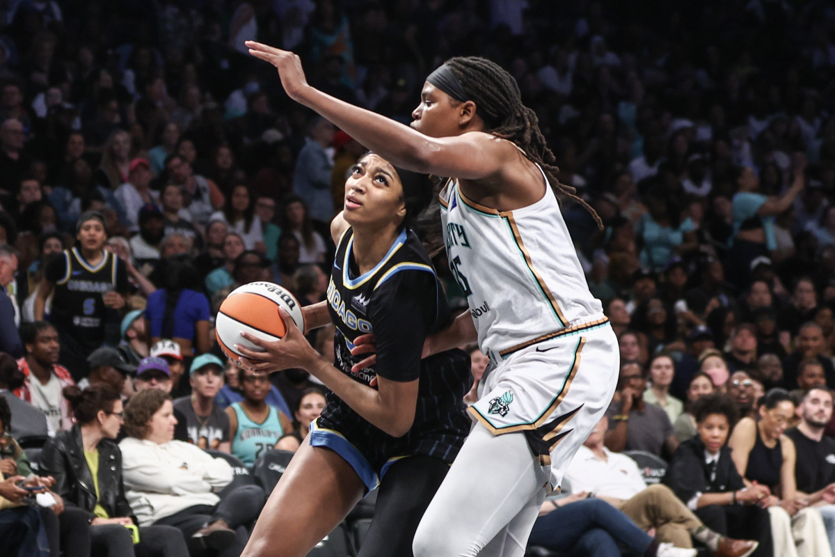 Chicago Sky forward Angel Reese (5) drives past New York Liberty forward Jonquel Jones