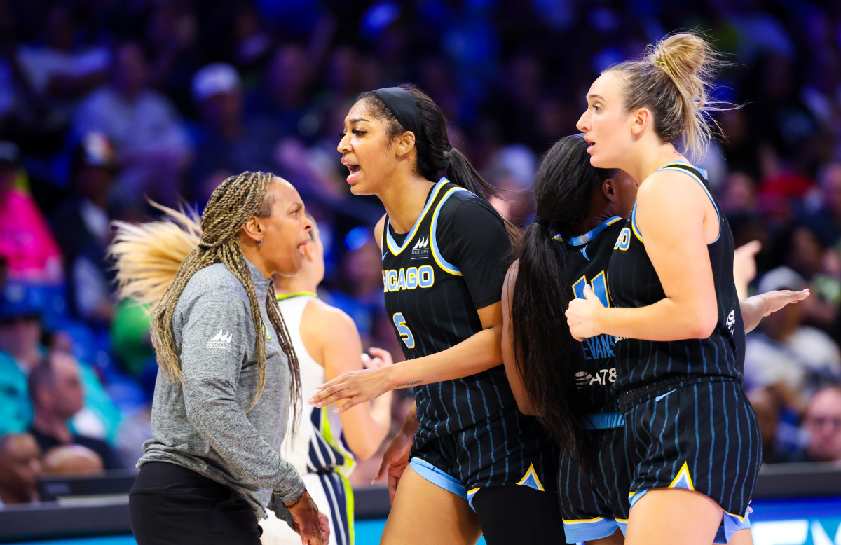 Chicago Sky forward Angel Reese (5) celebrates with Chicago Sky head coach Teresa Weatherspoon during the second half against the Dallas Wings at College Park Center.