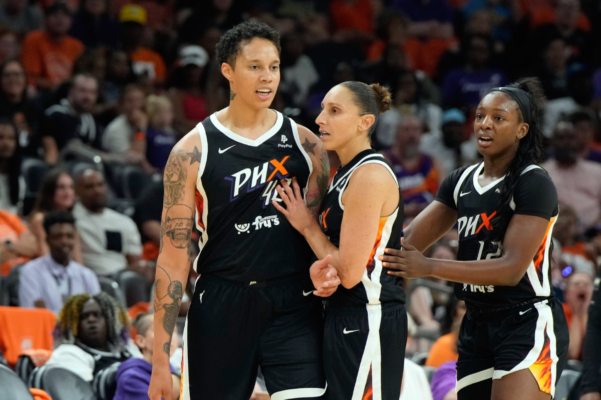 Phoenix Mercury guard Diana Taurasi (3) holds back Phoenix Mercury center Brittney Griner (42) after a foul call in the second half against the Chicago Sky at Footprint Center.
