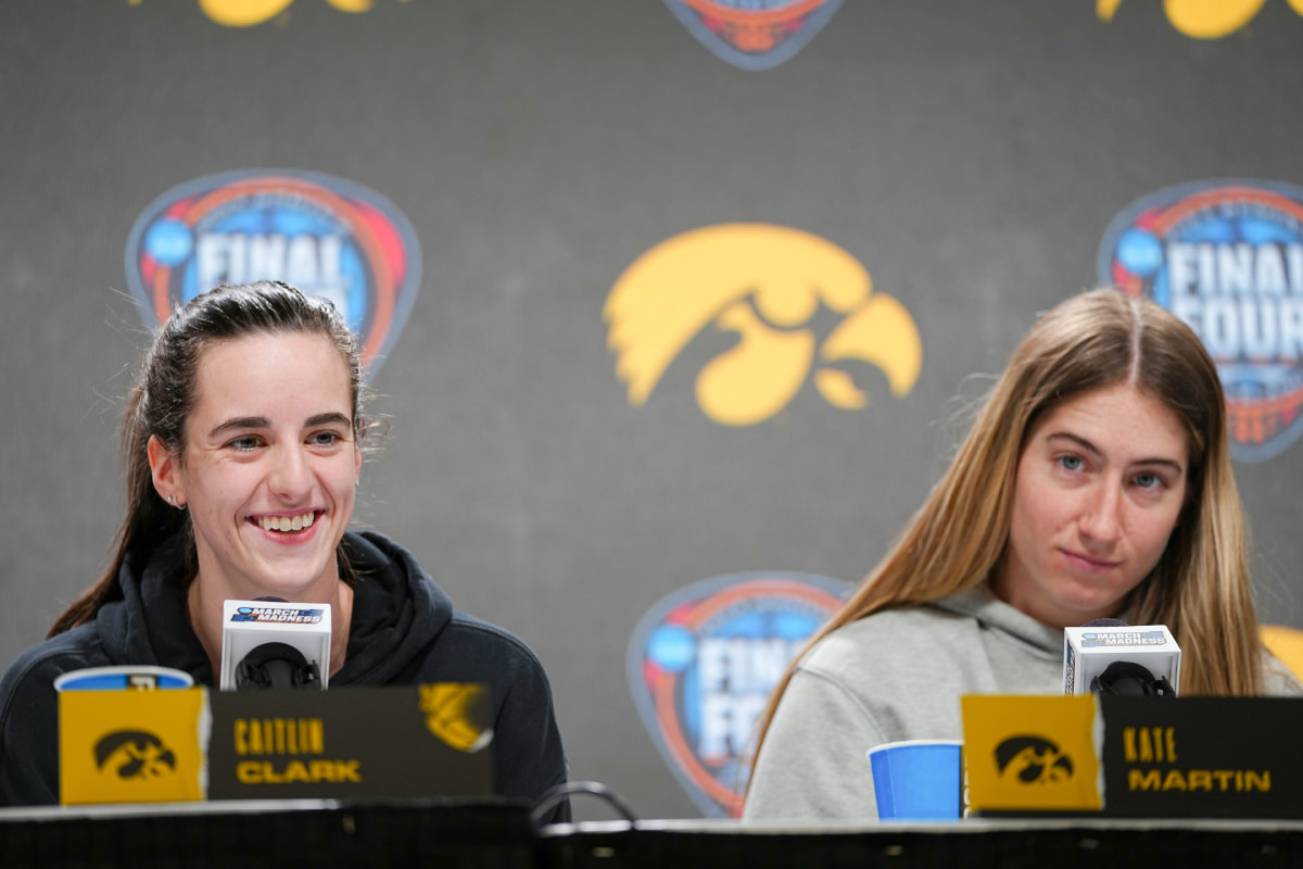 Iowa Hawkeyes guard Caitlin Clark and guard Kate Martin (20) take questions before the Final Four round of the NCAA Women's Basketball Tournament, Thursday, April 4, 2024 in Cleveland. 