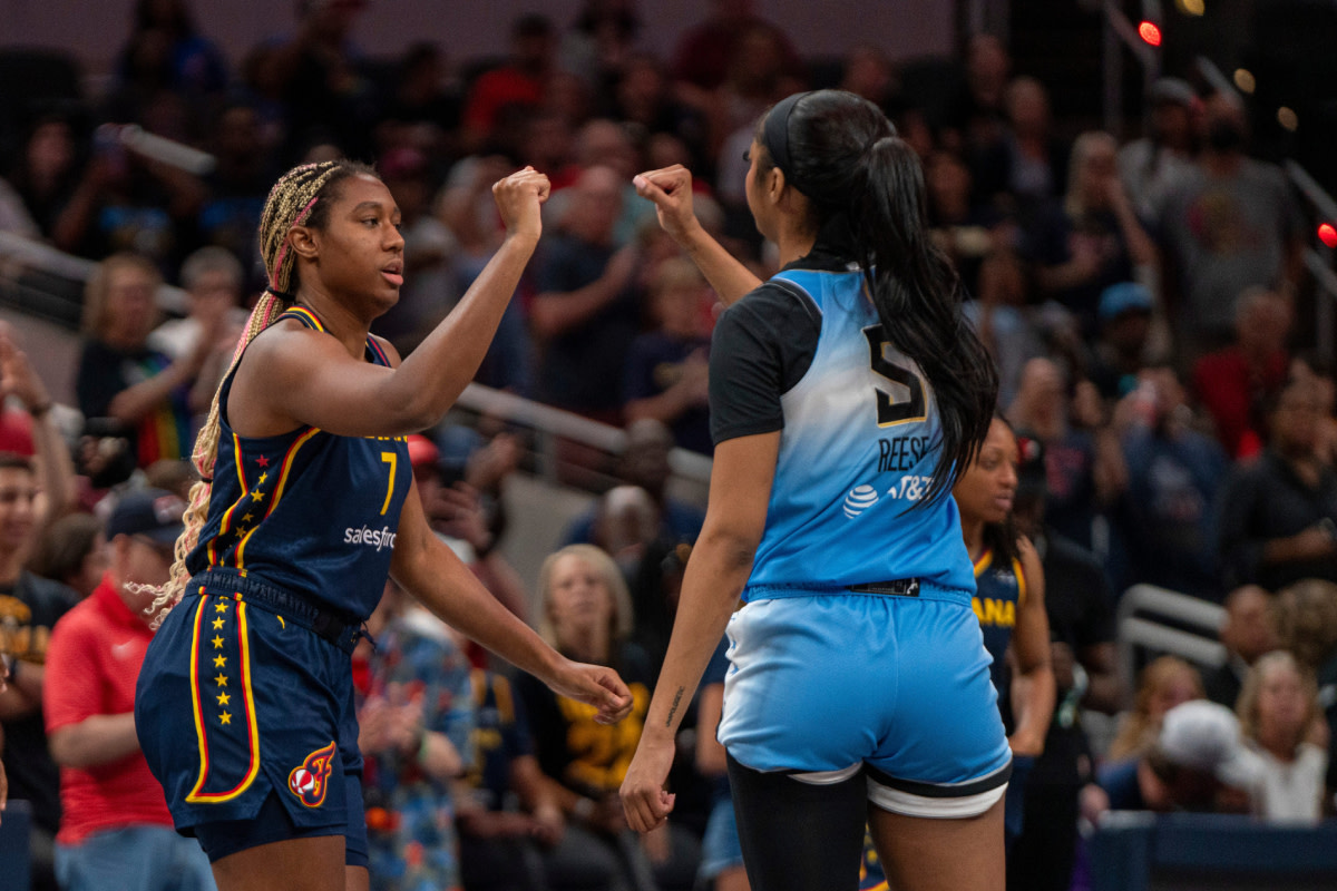 Indiana Fever forward Aliyah Boston (7) bumps fists with Chicago Sky forward Angel Reese (5) on Sunday June 16, 2024, before the game at Gainbridge Fieldhouse in Indianapolis. 